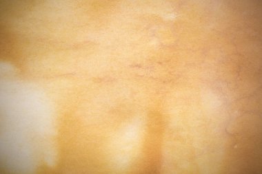 Aged paper sheet. Blank old background with dust and dirty stains. Vintage and antique art concept. Poster mockup. Detailed closeup studio shot. Front view. Toned