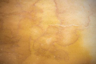 Aged paper sheet. Blank old background with dust and dirty stains. Vintage and antique art concept. Poster mockup. Detailed closeup studio shot. Front view. Toned