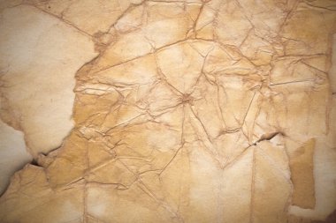 Aged paper sheet. Blank old background with dust and dirty stains. Vintage and antique art concept. Poster mockup. Detailed closeup studio shot. Front view. Toned