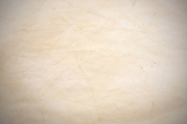 Aged paper sheet. Blank old background with dust and dirty stains. Vintage and antique art concept. Poster mockup. Detailed closeup studio shot. Front view. Toned