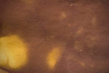 Aged paper sheet. Blank old background with dust and dirty stains. Vintage and antique art concept. Poster mockup. Detailed closeup studio shot. Front view. Toned