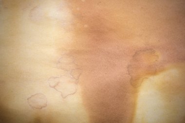 Aged paper sheet. Blank old background with dust and dirty stains. Vintage and antique art concept. Poster mockup. Detailed closeup studio shot. Front view. Toned