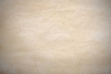 Aged paper sheet. Blank old background with dust and dirty stains. Vintage and antique art concept. Poster mockup. Detailed closeup studio shot. Front view. Toned