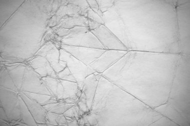 Eski kağıt çarşaf. Toz ve kirli lekelerle dolu boş bir arka plan. Eski ve antika sanat konsepti. Ayrıntılı yakın çekim stüdyo çekimi. Ön manzara. Ayarlanmış