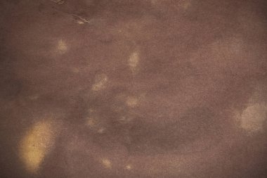 Aged paper sheet. Blank old background with dust and dirty stains. Vintage and antique art concept. Poster mockup. Detailed closeup studio shot. Front view. Toned