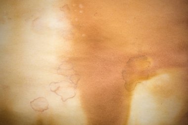 Aged paper sheet. Blank old background with dust and dirty stains. Vintage and antique art concept. Poster mockup. Detailed closeup studio shot. Front view. Toned