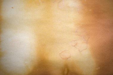 Aged paper sheet. Blank old background with dust and dirty stains. Vintage and antique art concept. Poster mockup. Detailed closeup studio shot. Front view. Toned