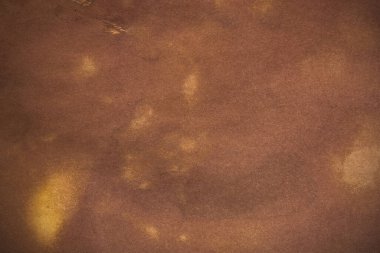 Aged paper sheet. Blank old background with dust and dirty stains. Vintage and antique art concept. Poster mockup. Detailed closeup studio shot. Front view. Toned