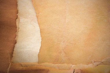 Aged paper sheet. Blank old background with dust and dirty stains. Vintage and antique art concept. Poster mockup. Detailed closeup studio shot. Front view. Toned