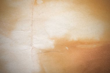 Aged paper sheet. Blank old background with dust and dirty stains. Vintage and antique art concept. Poster mockup. Detailed closeup studio shot. Front view. Toned