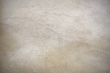 Aged paper sheet. Blank old background with dust and dirty stains. Vintage and antique art concept. Poster mockup. Detailed closeup studio shot. Front view. Toned