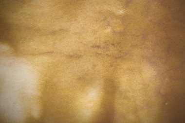 Aged paper sheet. Blank old background with dust and dirty stains. Vintage and antique art concept. Poster mockup. Detailed closeup studio shot. Front view. Toned