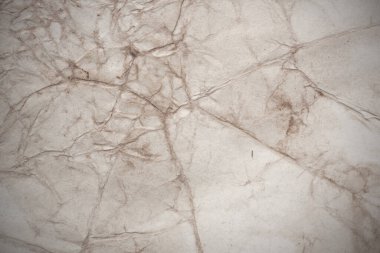 Aged paper sheet. Blank old background with dust and dirty stains. Vintage and antique art concept. Poster mockup. Detailed closeup studio shot. Front view. Toned