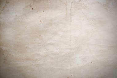 Aged paper sheet. Blank old background with dust and dirty stains. Vintage and antique art concept. Poster mockup. Detailed closeup studio shot. Front view. Toned