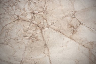 Aged paper sheet. Blank old background with dust and dirty stains. Vintage and antique art concept. Poster mockup. Detailed closeup studio shot. Front view. Toned