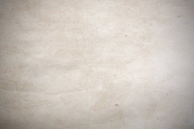 Aged paper sheet. Blank old background with dust and dirty stains. Vintage and antique art concept. Poster mockup. Detailed closeup studio shot. Front view. Toned
