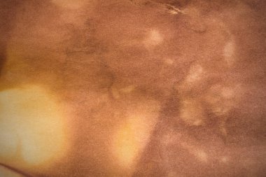 Aged paper sheet. Blank old background with dust and dirty stains. Vintage and antique art concept. Poster mockup. Detailed closeup studio shot. Front view. Toned