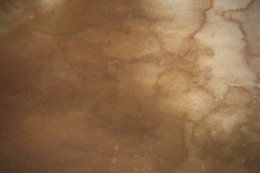 Aged paper sheet. Blank old background with dust and dirty stains. Vintage and antique art concept. Poster mockup. Detailed closeup studio shot. Front view. Toned