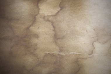 Aged paper sheet. Blank old background with dust and dirty stains. Vintage and antique art concept. Poster mockup. Detailed closeup studio shot. Front view. Toned