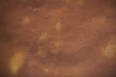 Aged paper sheet. Blank old background with dust and dirty stains. Vintage and antique art concept. Poster mockup. Detailed closeup studio shot. Front view. Toned