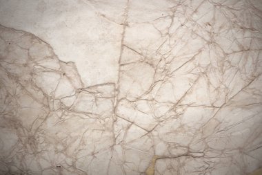 Aged paper sheet. Blank old background with dust and dirty stains. Vintage and antique art concept. Poster mockup. Detailed closeup studio shot. Front view. Toned