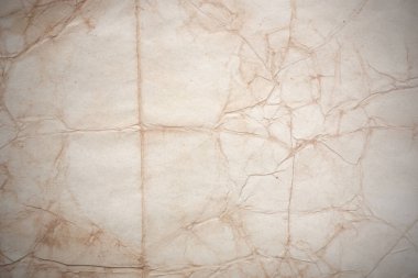 Aged paper sheet. Blank old background with dust and dirty stains. Vintage and antique art concept. Poster mockup. Detailed closeup studio shot. Front view. Toned