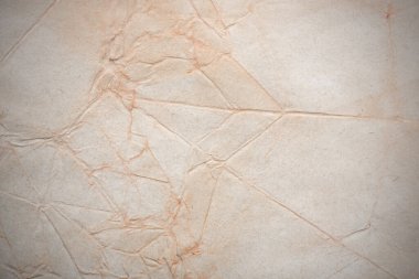 Aged paper sheet. Blank old background with dust and dirty stains. Vintage and antique art concept. Poster mockup. Detailed closeup studio shot. Front view. Toned