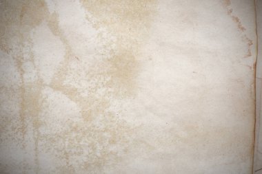 Aged paper sheet. Blank old background with dust and dirty stains. Vintage and antique art concept. Poster mockup. Detailed closeup studio shot. Front view. Toned