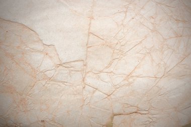 Aged paper sheet. Blank old background with dust and dirty stains. Vintage and antique art concept. Poster mockup. Detailed closeup studio shot. Front view. Toned