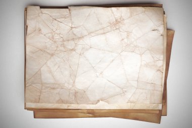 Aged paper sheet. Blank old background with dust and dirty stains. Vintage and antique art concept. Poster mockup. Detailed closeup studio shot. Front view. Toned