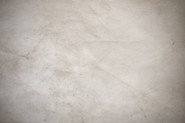 Aged paper sheet. Blank old background with dust and dirty stains. Vintage and antique art concept. Poster mockup. Detailed closeup studio shot. Front view. Toned