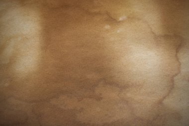 Aged paper sheet. Blank old background with dust and dirty stains. Vintage and antique art concept. Poster mockup. Detailed closeup studio shot. Front view. Toned