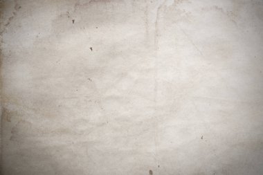 Aged paper sheet. Blank old background with dust and dirty stains. Vintage and antique art concept. Poster mockup. Detailed closeup studio shot. Front view. Toned