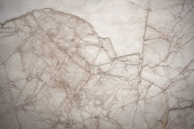 Aged paper sheet. Blank old background with dust and dirty stains. Vintage and antique art concept. Poster mockup. Detailed closeup studio shot. Front view. Toned