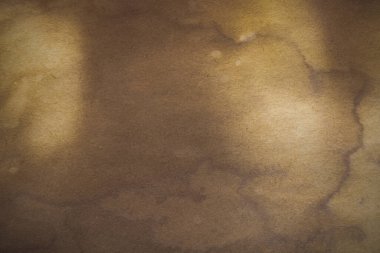 Aged paper sheet. Blank old background with dust and dirty stains. Vintage and antique art concept. Poster mockup. Detailed closeup studio shot. Front view. Toned