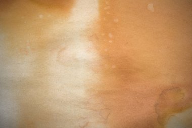 Aged paper sheet. Blank old background with dust and dirty stains. Vintage and antique art concept. Poster mockup. Detailed closeup studio shot. Front view. Toned