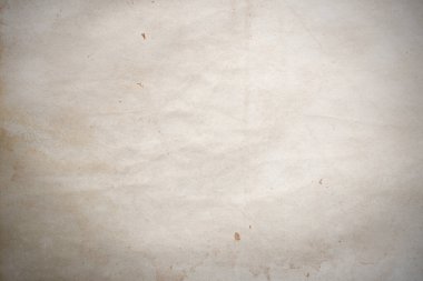 Aged paper sheet. Blank old background with dust and dirty stains. Vintage and antique art concept. Poster mockup. Detailed closeup studio shot. Front view. Toned