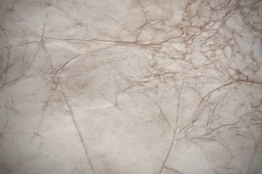 Aged paper sheet. Blank old background with dust and dirty stains. Vintage and antique art concept. Poster mockup. Detailed closeup studio shot. Front view. Toned