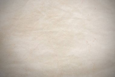 Aged paper sheet. Blank old background with dust and dirty stains. Vintage and antique art concept. Poster mockup. Detailed closeup studio shot. Front view. Toned