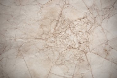 Aged paper sheet. Blank old background with dust and dirty stains. Vintage and antique art concept. Poster mockup. Detailed closeup studio shot. Front view. Toned