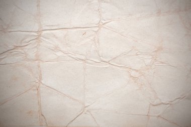 Aged paper sheet. Blank old background with dust and dirty stains. Vintage and antique art concept. Poster mockup. Detailed closeup studio shot. Front view. Toned