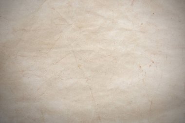 Aged paper sheet. Blank old background with dust and dirty stains. Vintage and antique art concept. Poster mockup. Detailed closeup studio shot. Front view. Toned