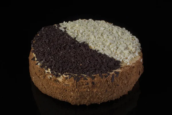 Cake with white and black chocolate on a black background.Russian cake day and night