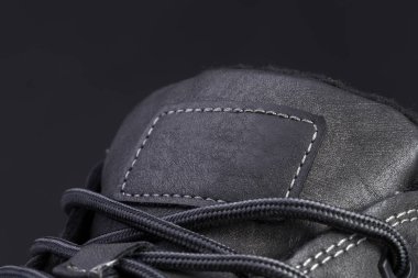 Deri bir botun parçası. Yakın plan. Deri ayakkabı dokusunun bir parçası..