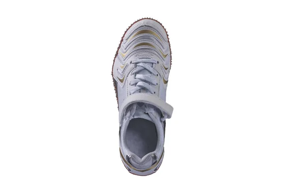 Verticale Witte Sneaker Met Vergulde Accenten Een Witte Achtergrond — Stockfoto