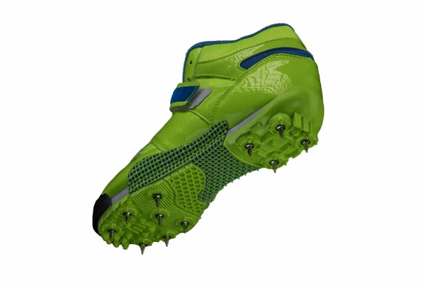 Groene Glanzende Sneaker Met Spikes Een Witte Achtergrond Sportschoenen — Stockfoto