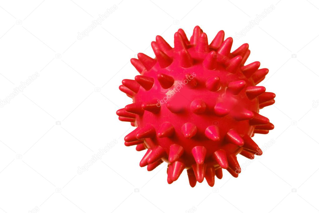 Red rubber ball with spikes on a white background.