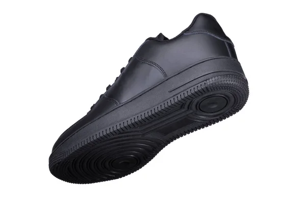 Een Zwarte Sneaker Een Witte Achtergrond Sportschoenen — Stockfoto