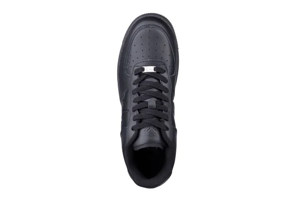 Een Zwarte Sneaker Een Witte Achtergrond Sportschoenen — Stockfoto