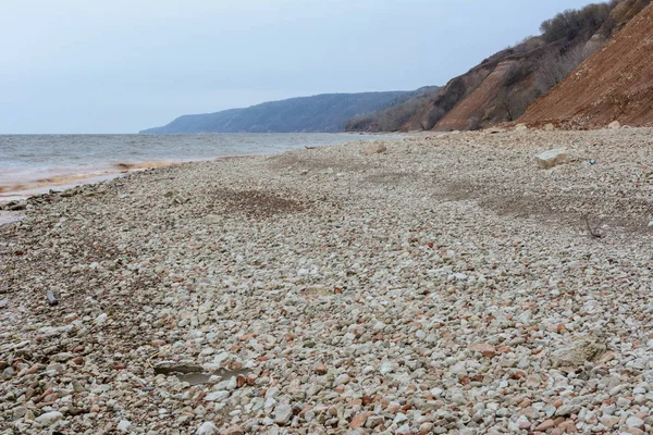 Stony, pebble and clay banks of the Volga River. Mountain slope
